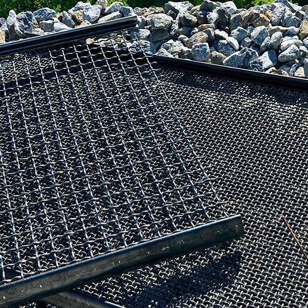 Several pieces of flattened expanded metal in the workshop.